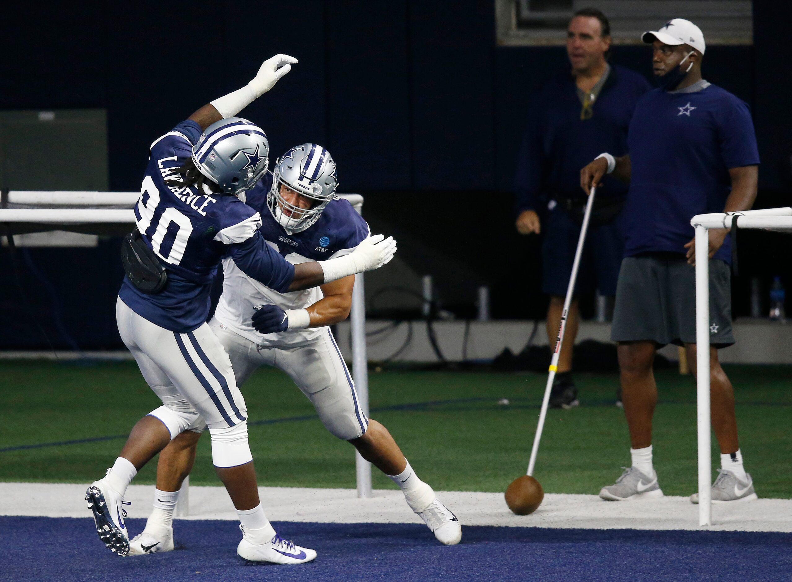 Dallas Cowboys defensive end Tyrone Crawford (98) runs through a drill with Dallas Cowboys...