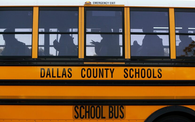 Buses drop students off at W.E. Greiner Exploratory Arts Academy in Dallas on Oct. 25, 2017....