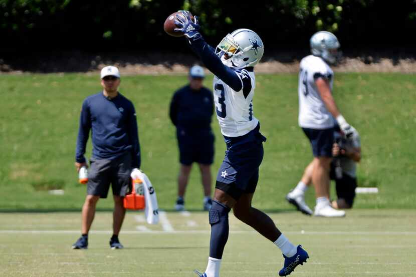 Dallas Cowboys wide receiver Michael Gallup (13) catches a pass as he ran routes with the...