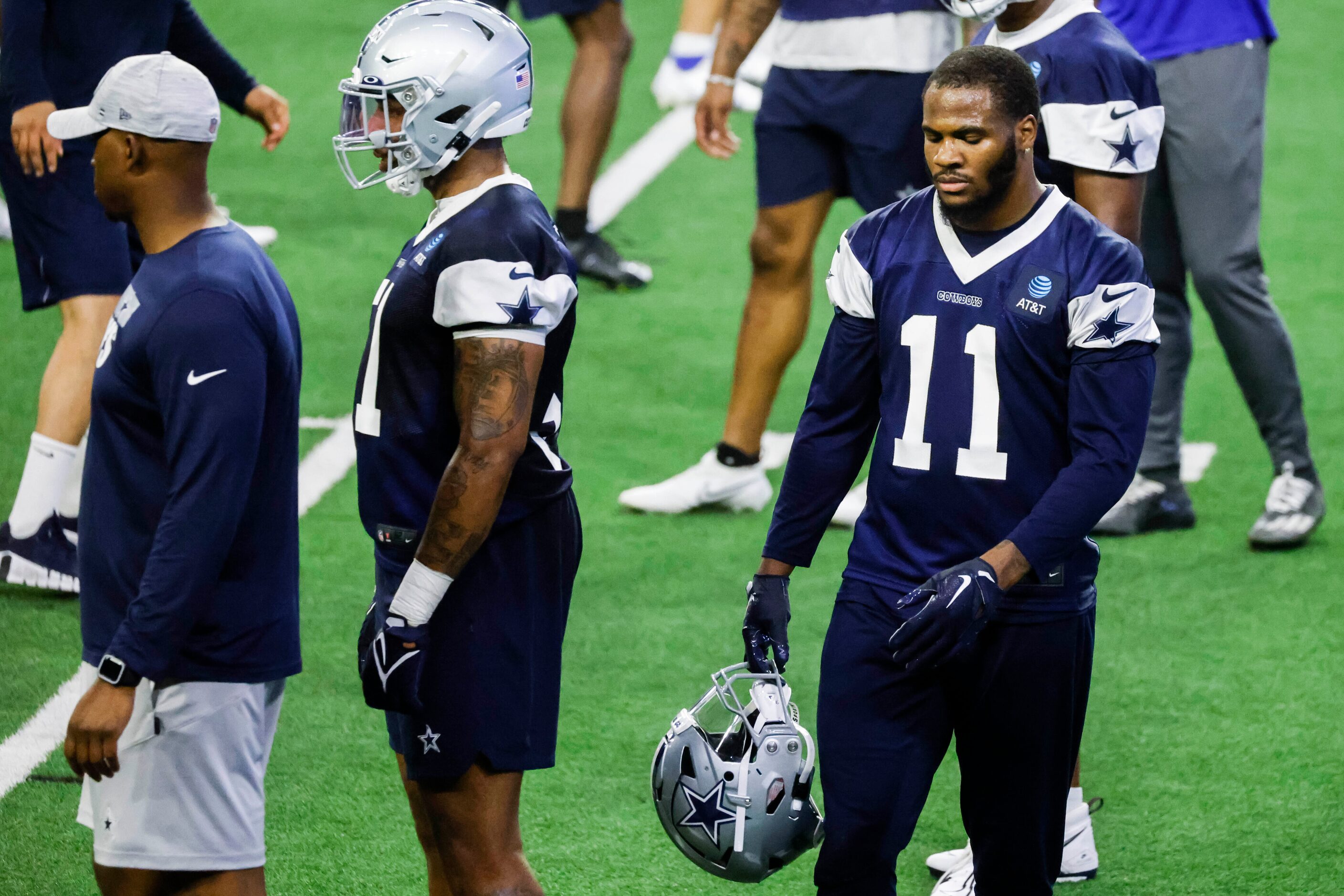 Dallas Cowboys linebacker Micah Parsons leaves the field during timeout in a OTA practice on...