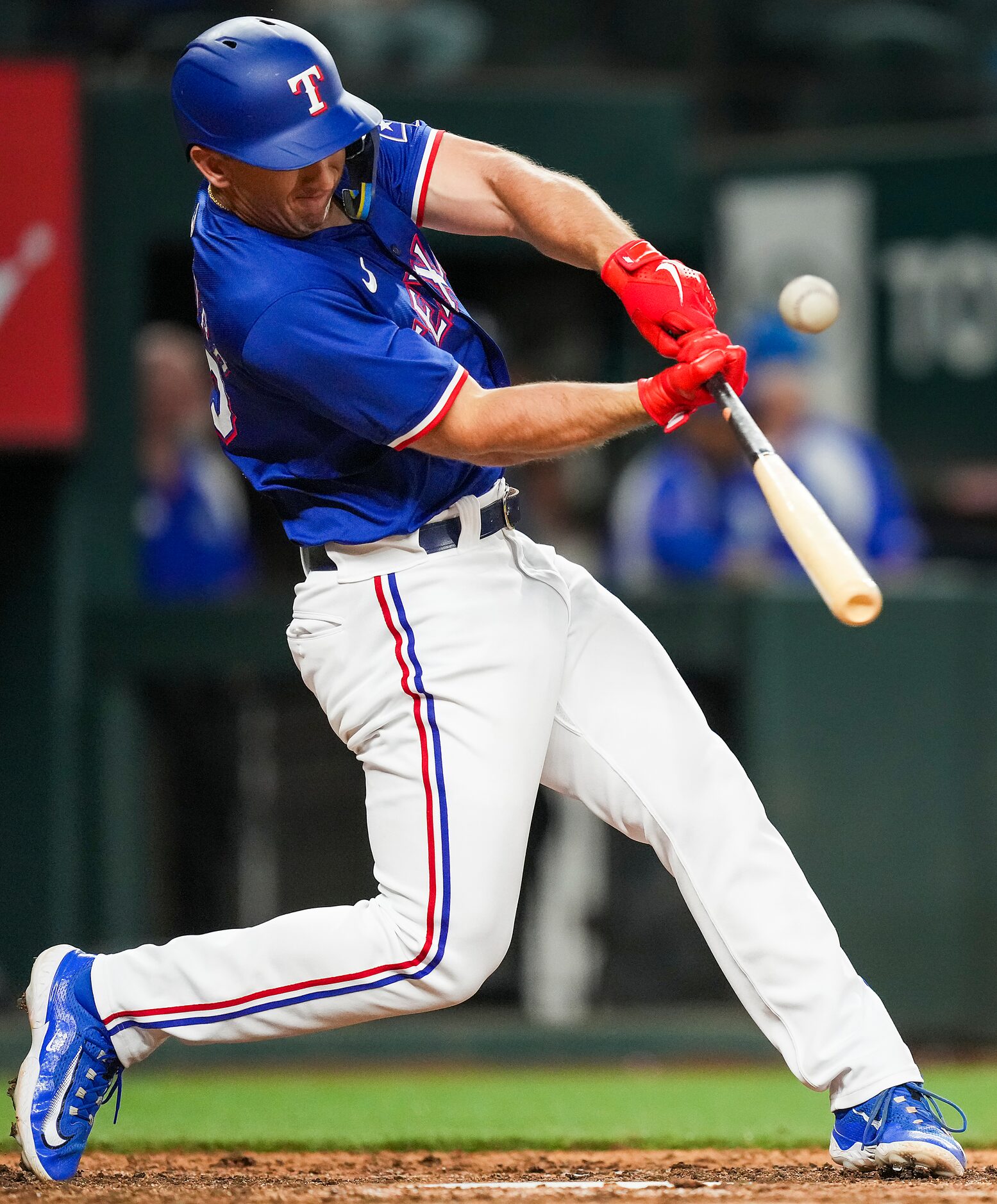 Texas Rangers designated hitter Wyatt Langford flies out to right field during the ninth...