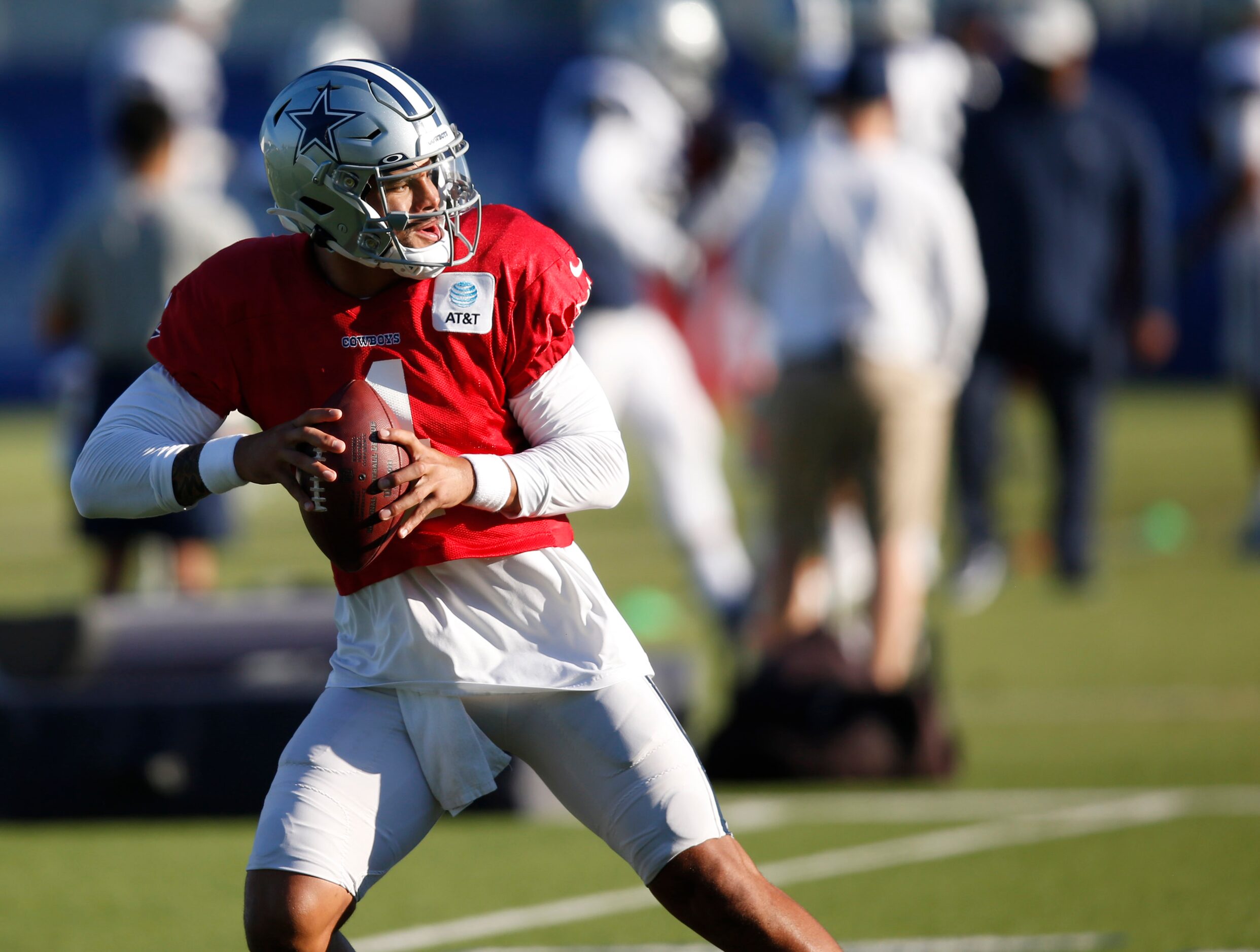 Dallas Cowboys quarterback Dak Prescott (4) runs through a drill during training camp at the...