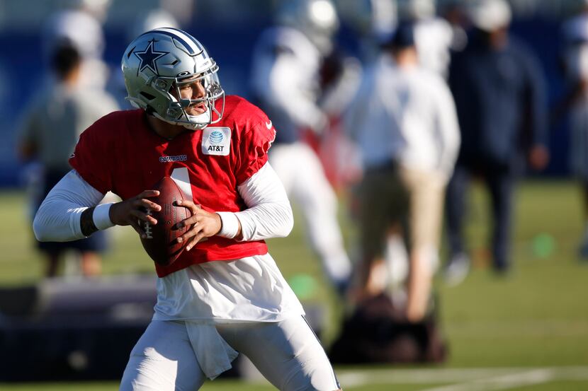 Dallas Cowboys quarterback Dak Prescott (4) runs through a drill during training camp at the...