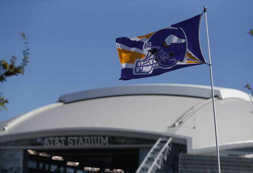 A Minnesota flag flies prior to the Dallas Cowboys- Minnesota Vikings NFL football game in...
