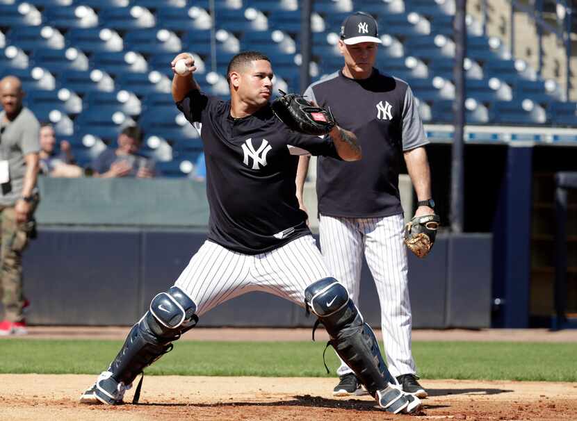 New York Yankees catcher Gary Sanchez works on drills at baseball spring training camp,...