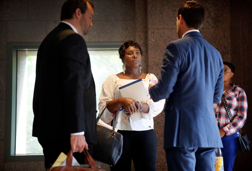 Linda Badawo (center) mother of D'ashon Morris, and her attorneys Bradley Reeves (right) and...