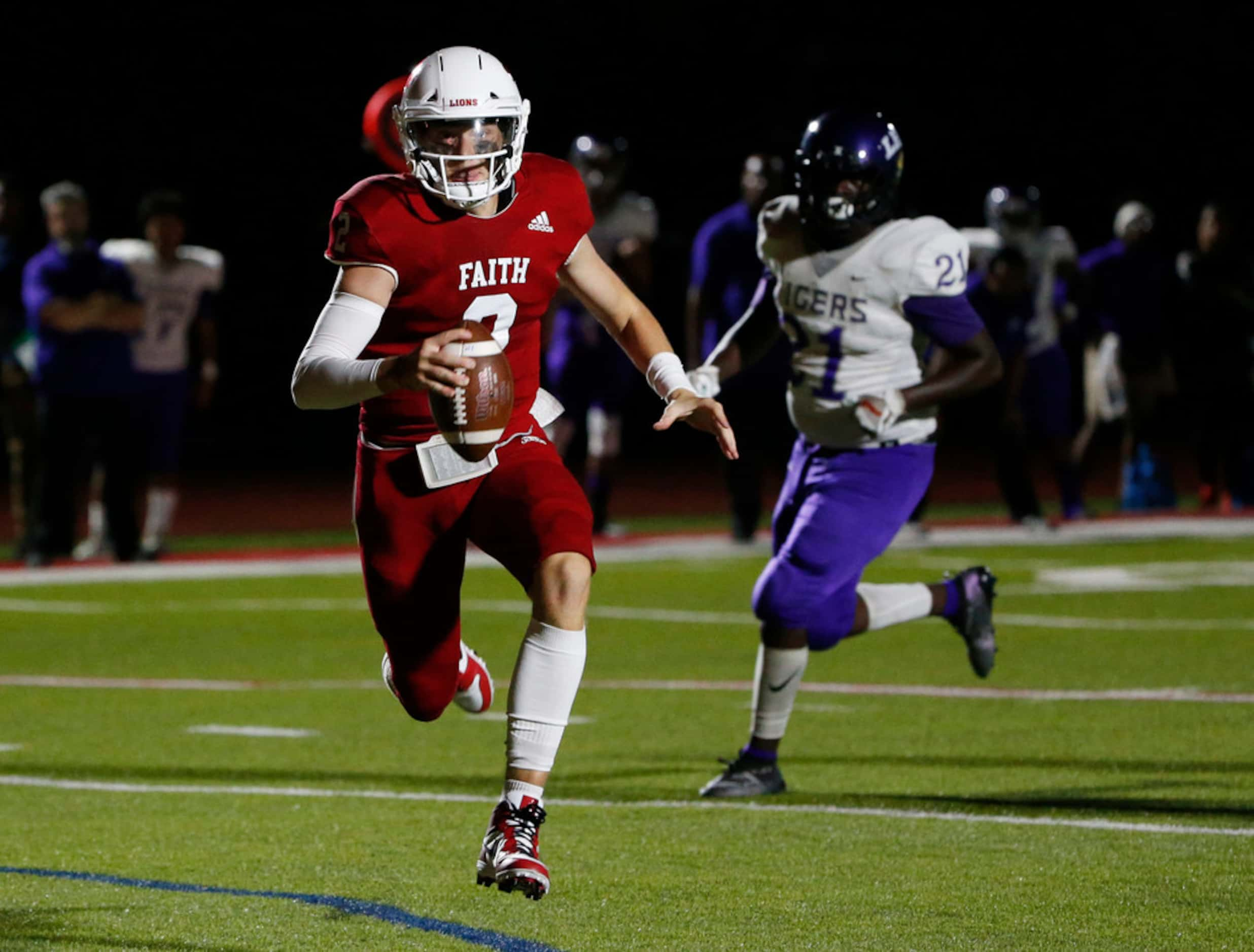 Grapevine Faith Christian quarterback Deuce Hogan runs for yardage against Lincoln during...