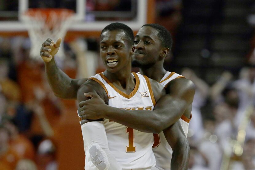 Texas guard Andrew Jones (1) and guard Courtney Ramey (3) celebrate a score against Kansas...