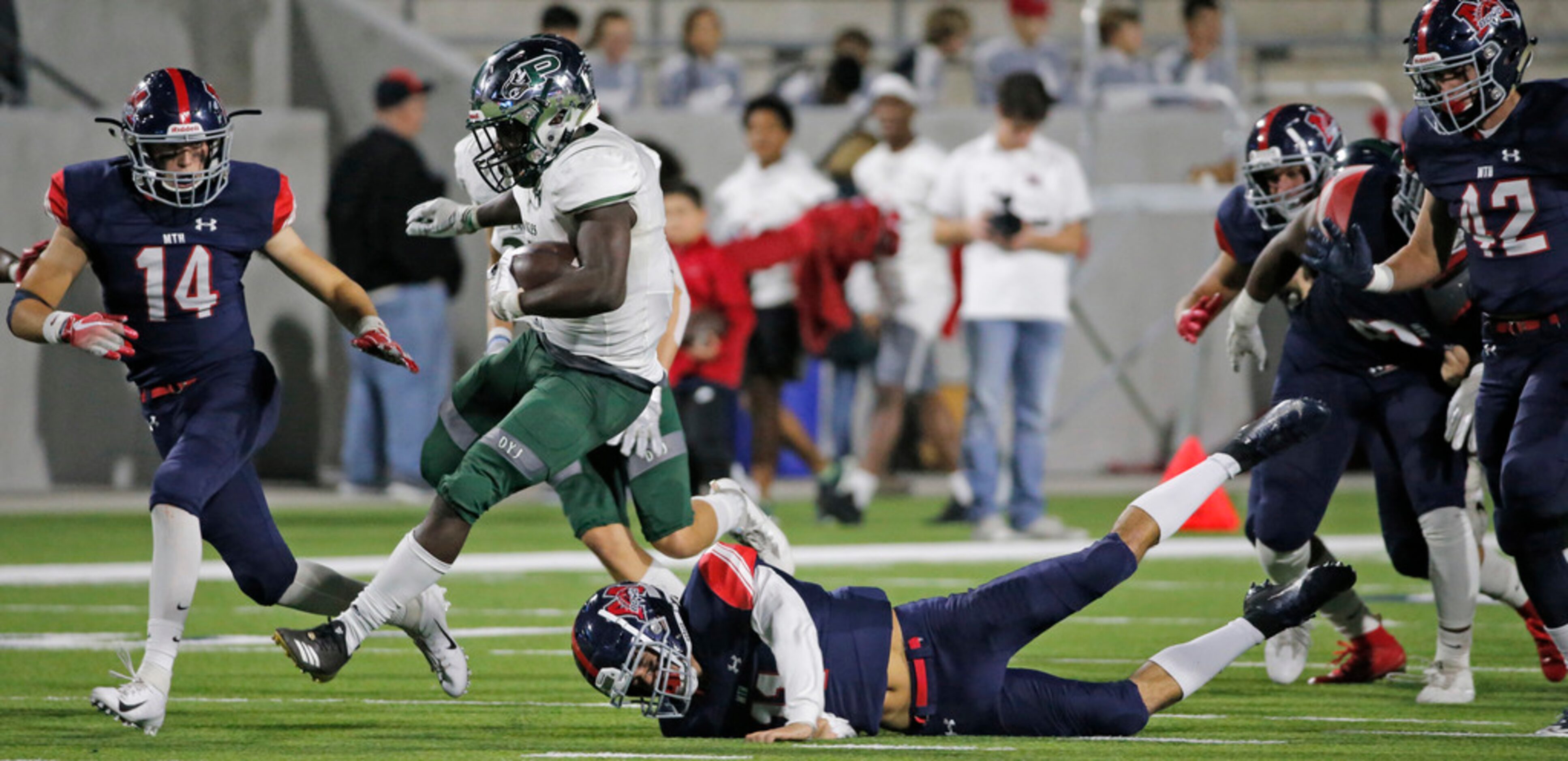 Prosper running back Wayne Anderson (7) breaks through the McKinney Boyd defense in the...