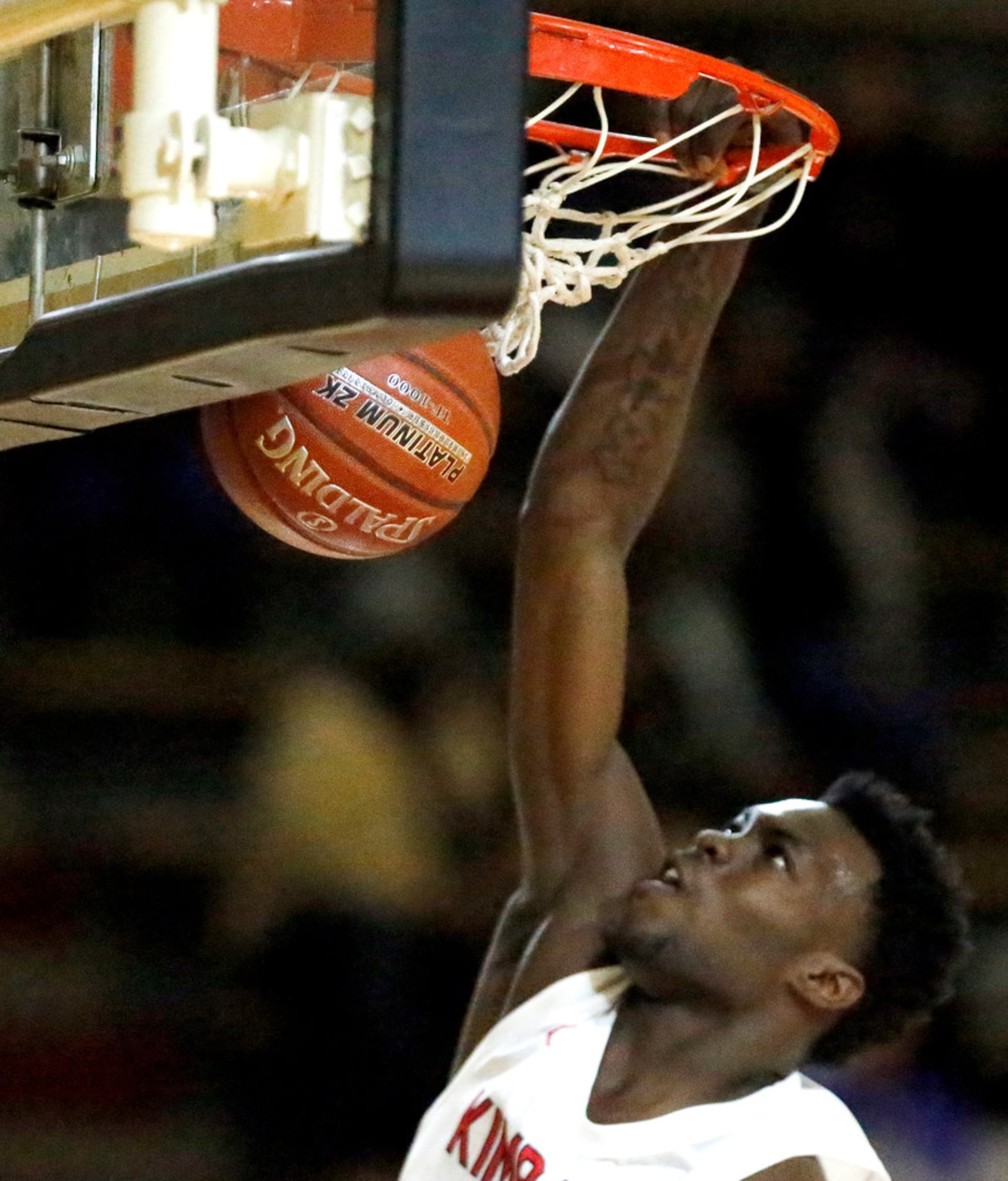 Kimball High School small forward Kyron Henderson (15) gets a slam dunk during the first...