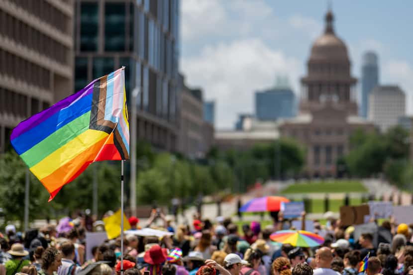 AUSTIN, TEXAS - APRIL 15: A Pride flag is seen held up in a crowd during preparation for a...