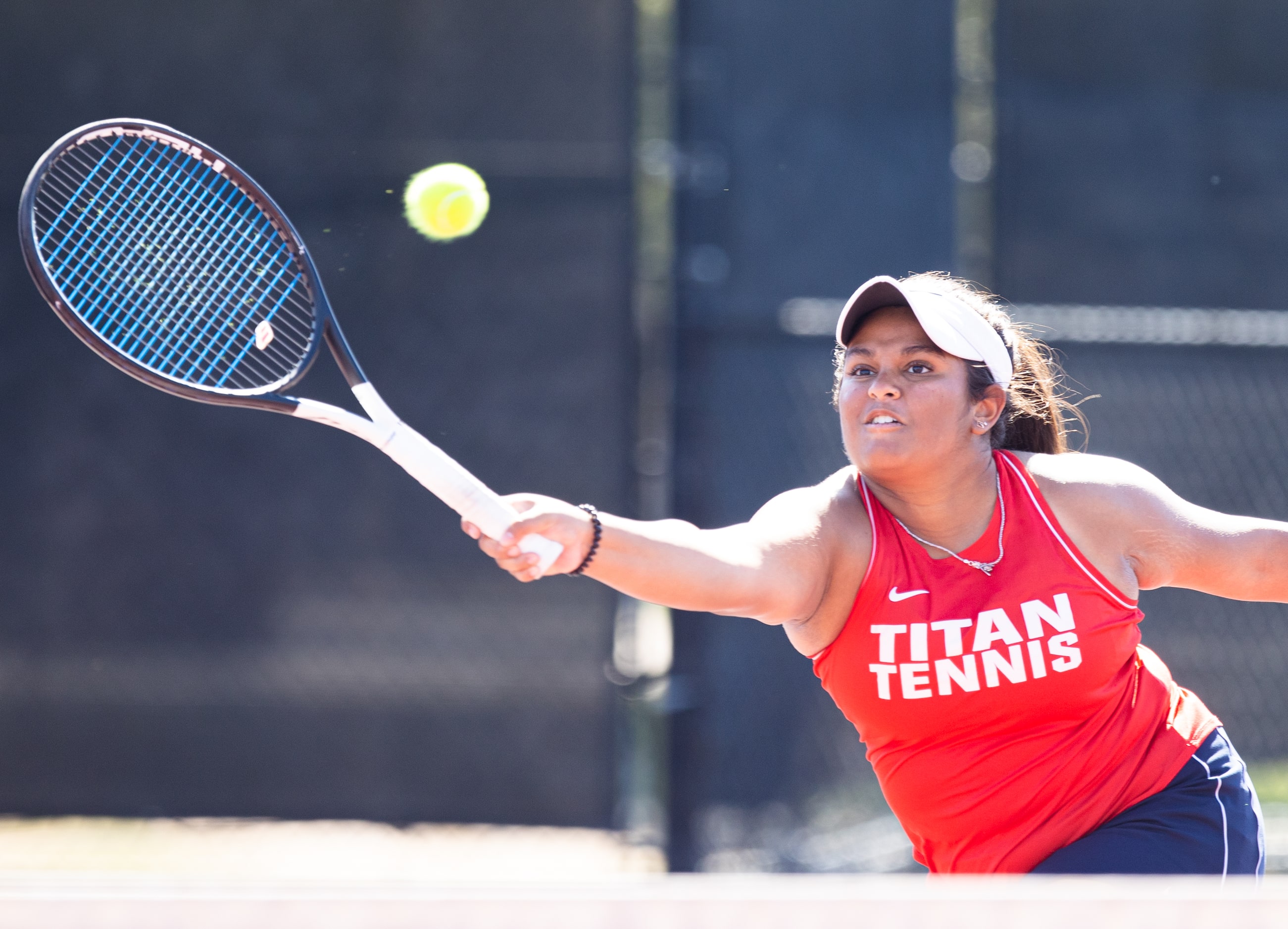 Frisco Centennial’s Aashikha Basappa returns a shot during a mixed doubles match with...