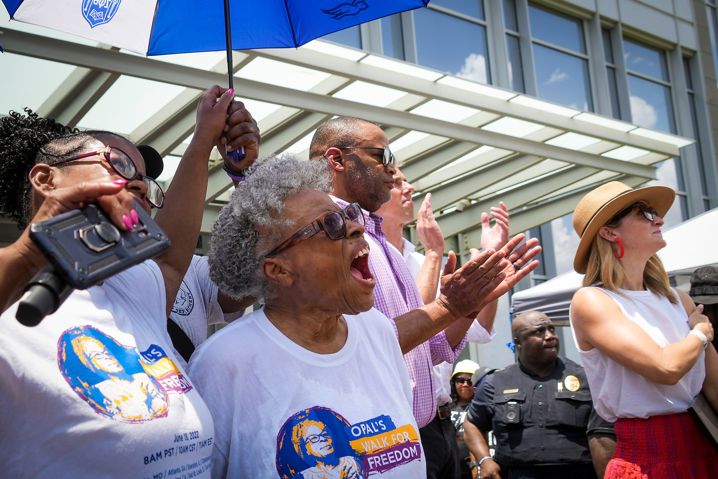 Opal Lee (center) cheers as the Juneteenth flag is raised at Fort Worth City Hall at the...