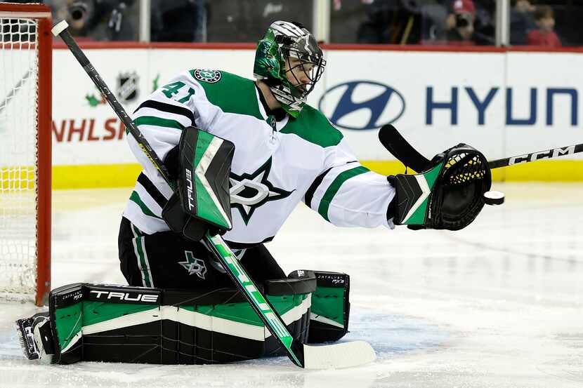 Dallas Stars goaltender Scott Wedgewood makes a save against the New Jersey Devils in the...