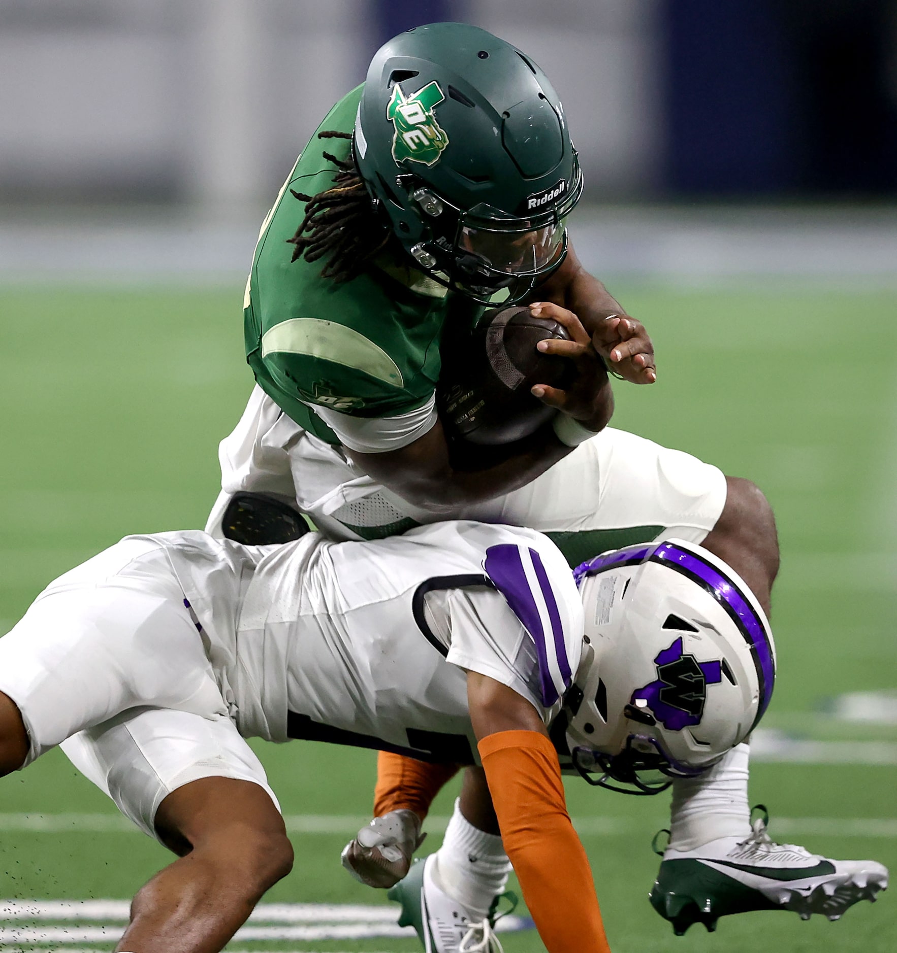 DeSoto quarterback Kelden Ryan is stopped for a nice gain by Willis safety Jermaine Bishop...