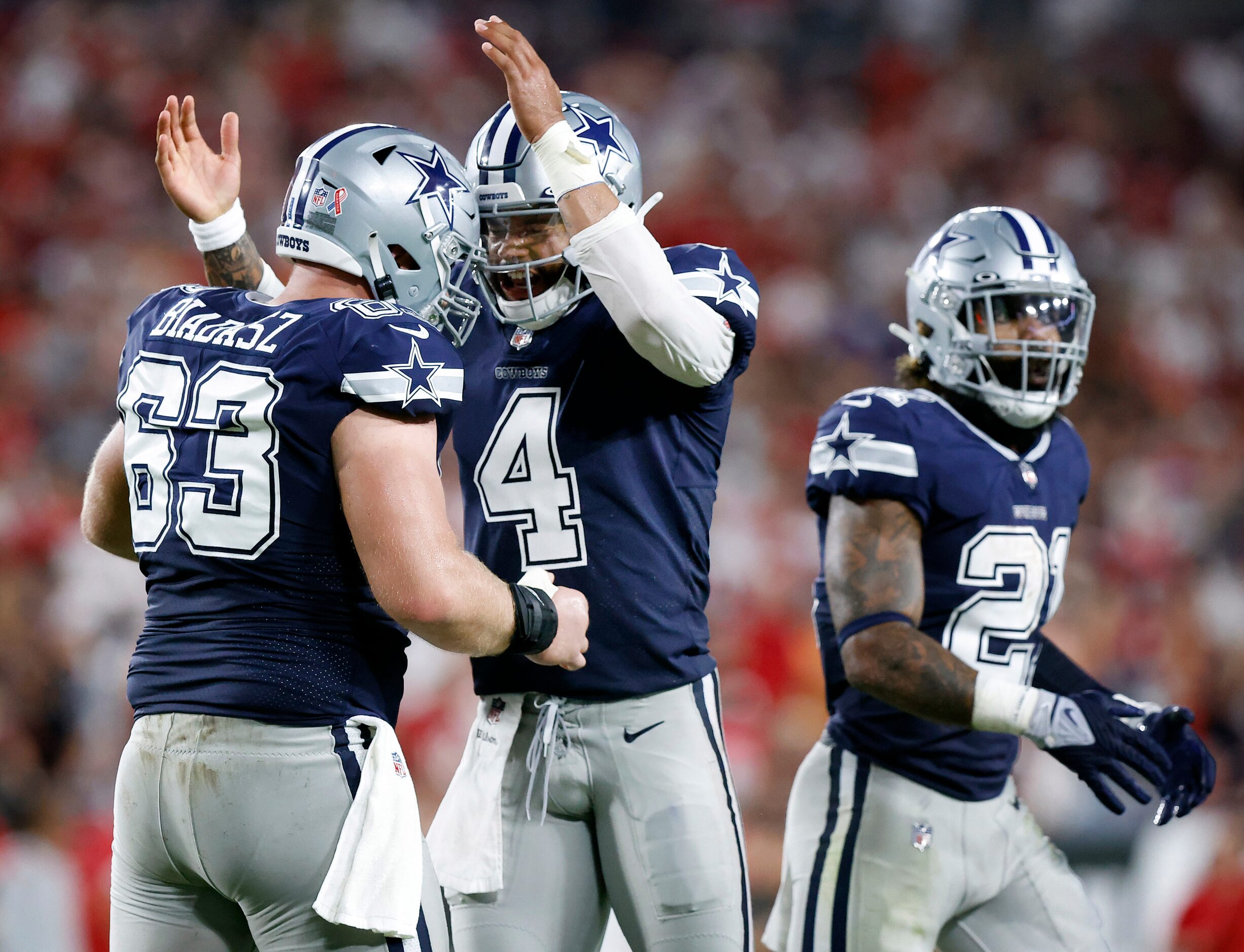 Dallas Cowboys quarterback Dak Prescott (4) and his center Tyler Biadasz (63) celebrate...