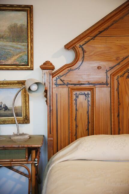 An antique bed sits in the guest room of Richard Theiss. 