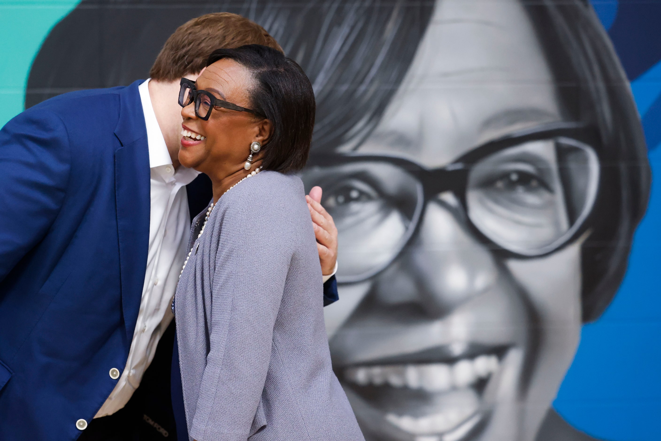 Dallas Mavericks CEO Cynthia Marshall receives a hug from governor and majority owner,...