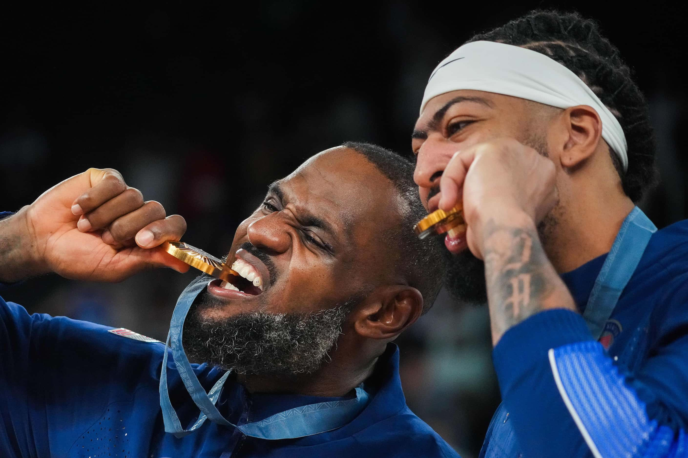 Lebron James (left) and Anthony Davis of the United States pose for photos with their medals...