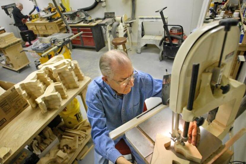 Marvin Thompson cut one of the 1,300 toys he and other woodworkers at Edgemere made for...