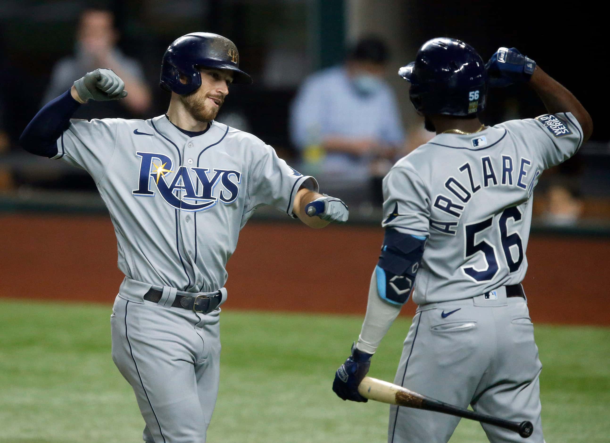Tampa Bay Rays Brandon Lowe (8) is congratulated on his solo home run by teammate Randy...