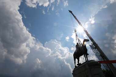 A statue of confederate general Stonewall Jackson is removed on July 1, 2020, in Richmond,...