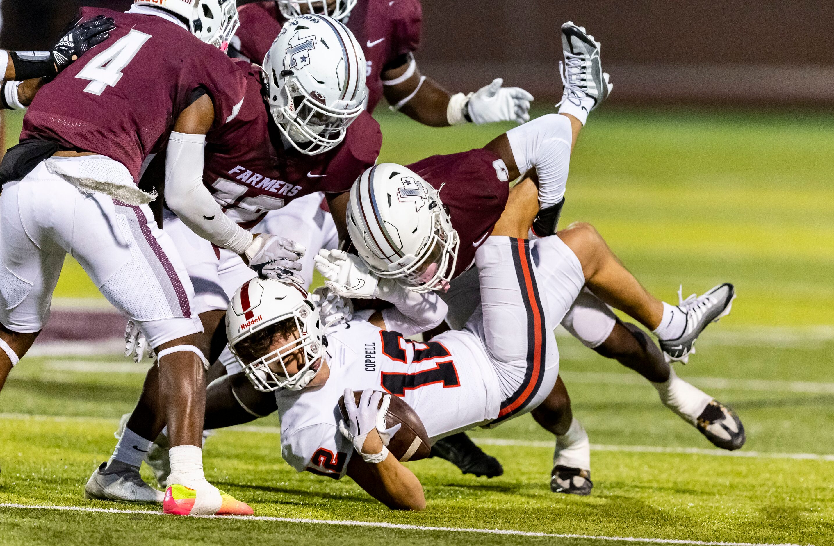 Lewisville senior defensive back Cameren Jenkins (2) tackles Coppell junior wide receiver...