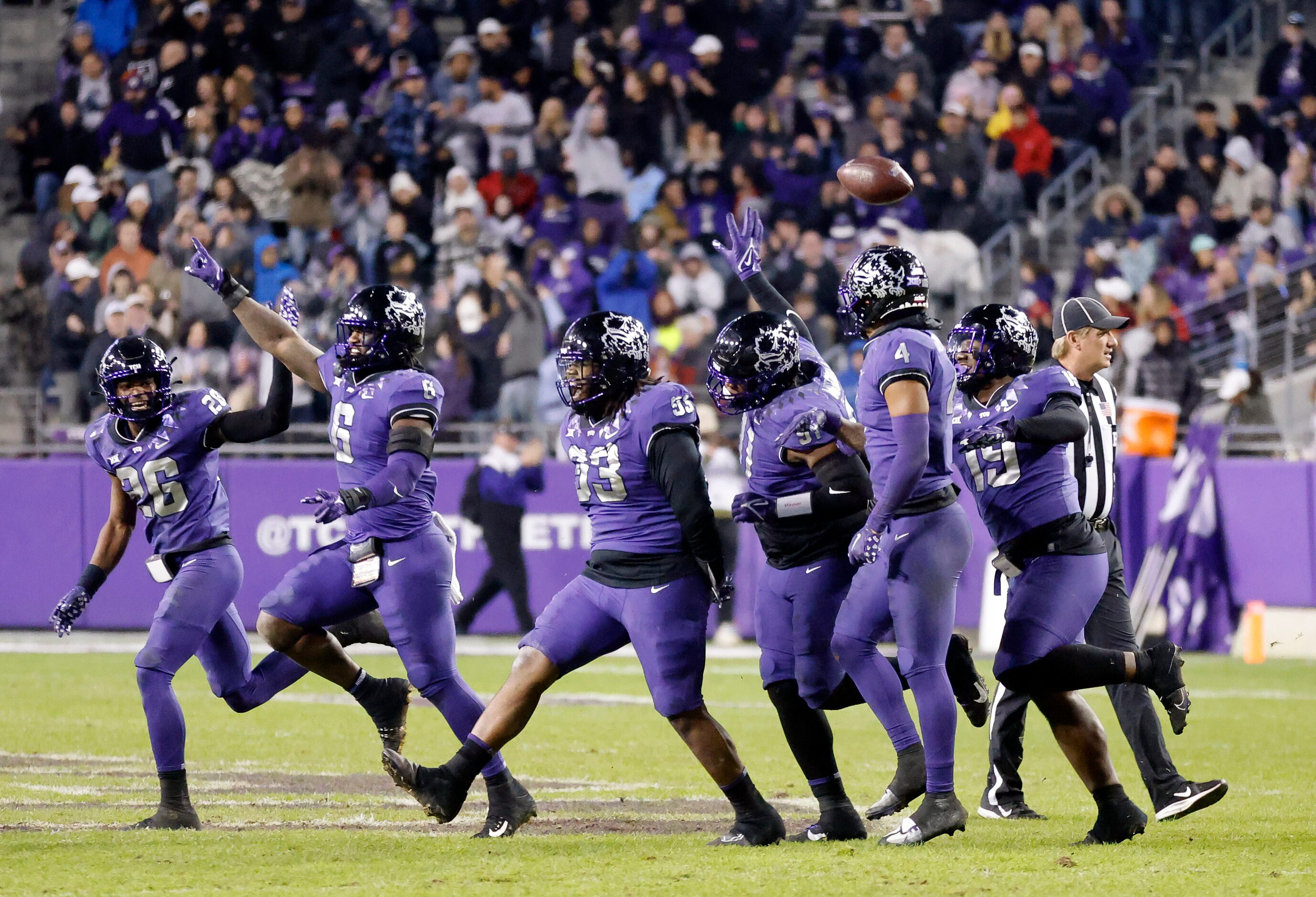 The TCU Horned Frogs defense celebrates a third quarter fumble recovery against the Iowa...