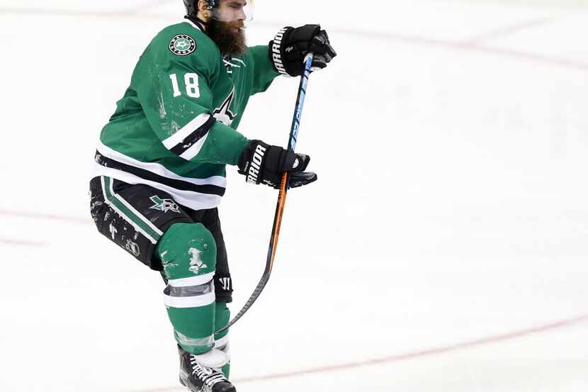 Dallas Stars right wing Patrick Eaves (18) limps off the ice on one skate after getting...