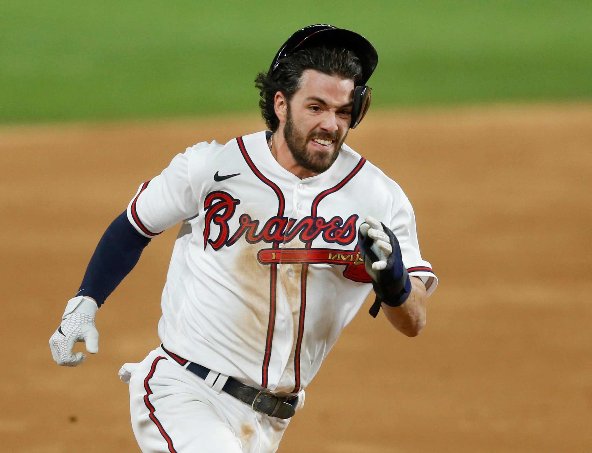 Atlanta Braves shortstop Dansby Swanson (7) runs to third base off a hit from Atlanta Braves...