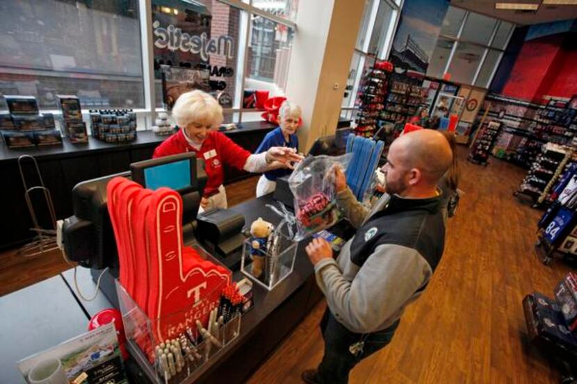 Rangers fan Casey Boggess bought Rangers duds for himself and his girlfriend Wednesday at...