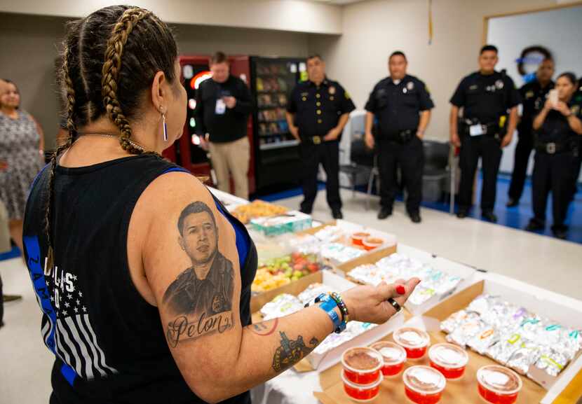 Valerie Zamarripa speaks to the Dallas police Southwest Patrol division before serving them...