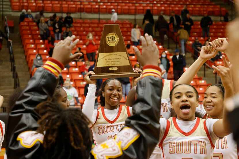 South Grand Prairie’s Jahcelyn Hartfield, center, and Ahrianna Morgan, right, celebrate with...