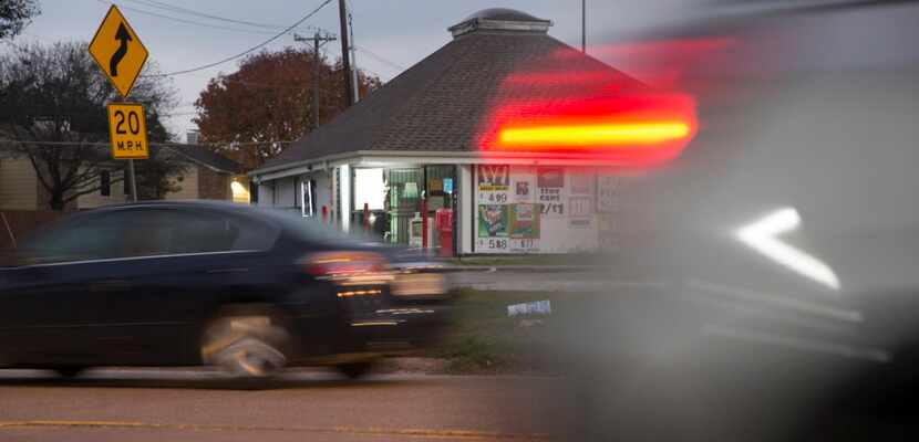 Vehicles drive past J's Food Mart at 10041 Whitehurst Drive in the Lake Highlands area.