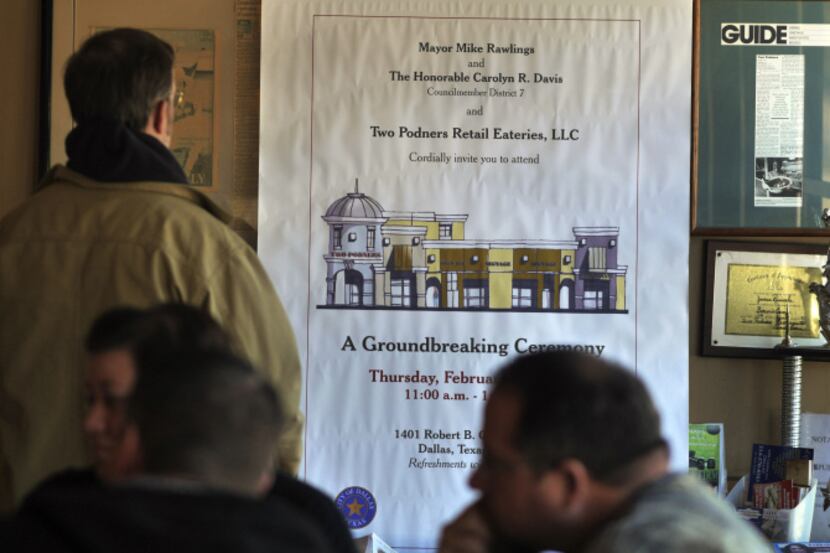 A notice of the ceremonial groundbreaking that takes place today hangs inside Two Podners...