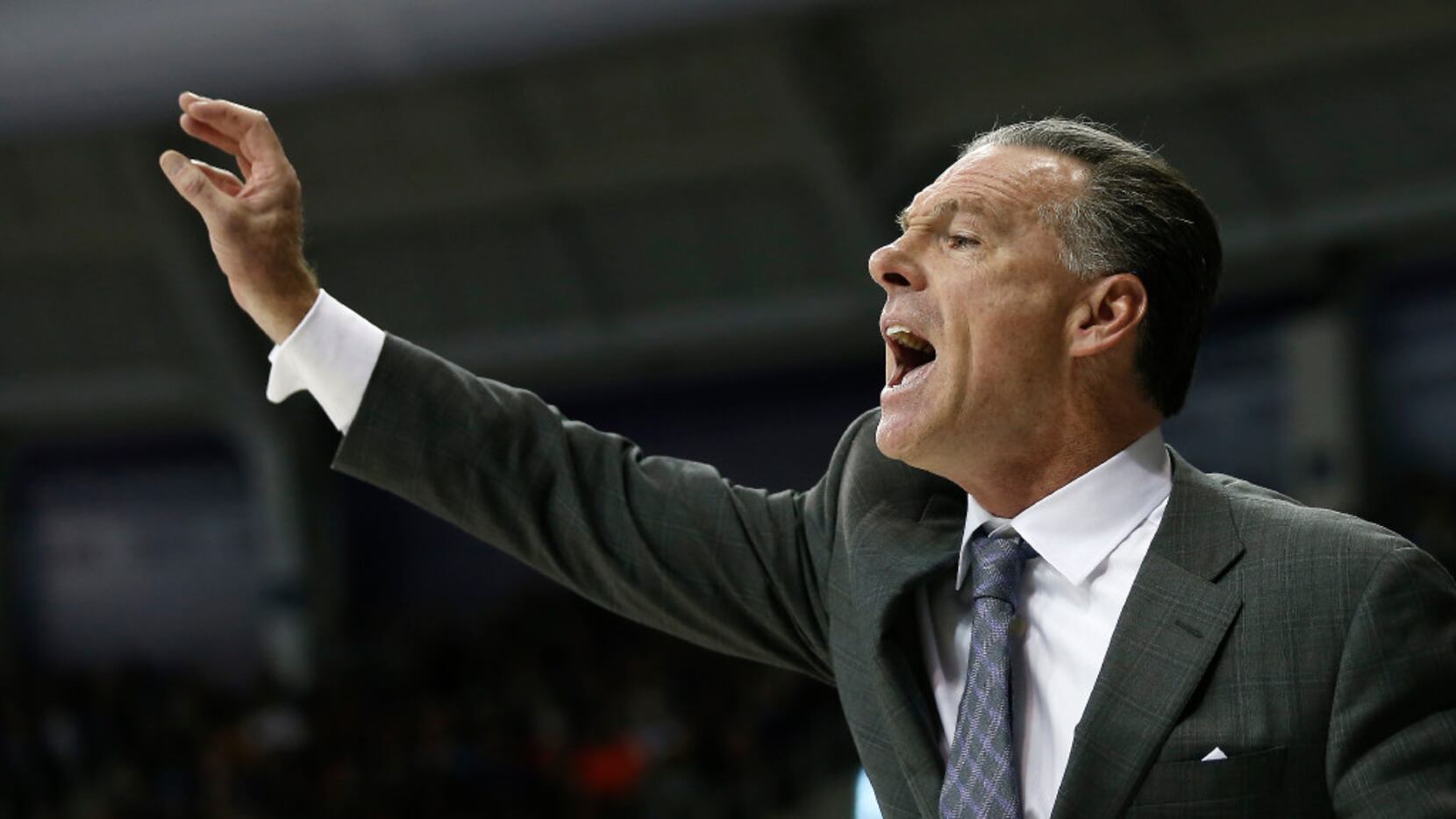 TCU Horned Frogs head coach Jamie Dixon yells from the bench during the second half against...