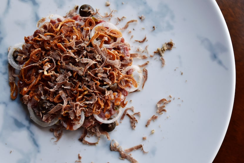 The smoked steak tartare with black garlic mustard, shallots and jerky