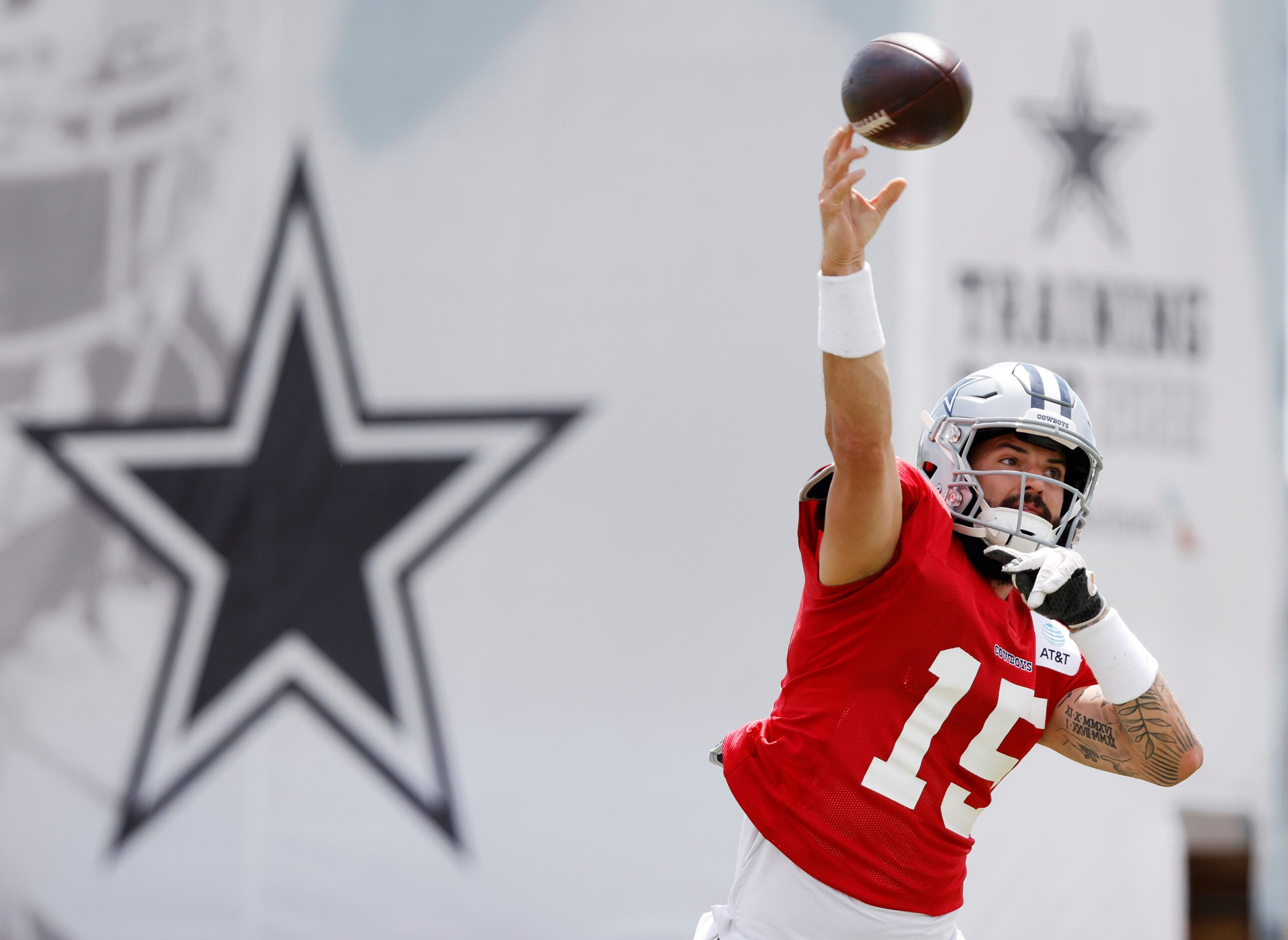 Dallas Cowboys quarterback Will Grier (15) throws  during training camp practice passing...