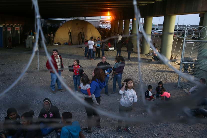 Migrants, including young children and babies, seeking asylum are seen in a U.S. Border...