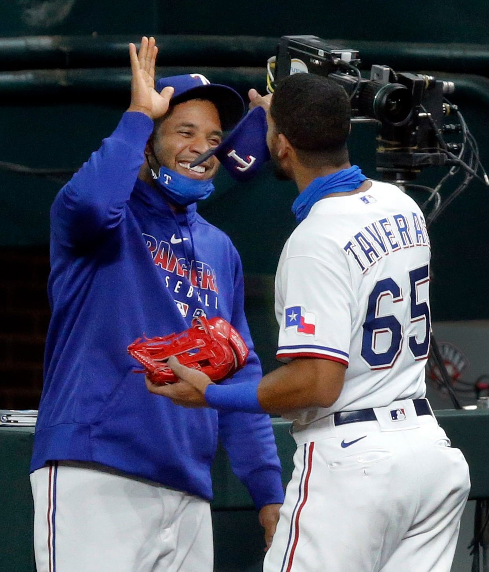 Texas Rangers center fielder Leody Taveras (65) is congratulated by teammate Elvis Andrus...