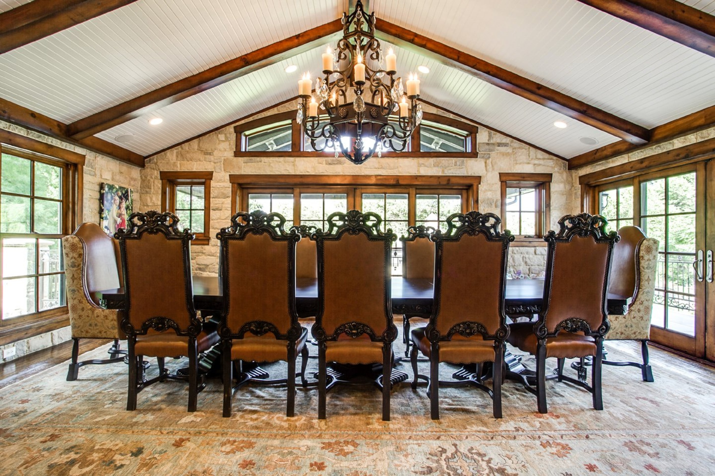 The home's only dining room, which features large open panel windows. 