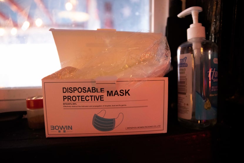 Disposable masks and hand sanitizer are stationed at the door of Charlie's Star Lounge.