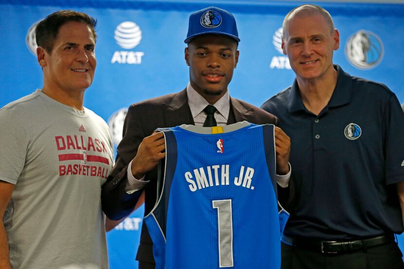 Mavericks first round pick Dennis Smith Jr. (center) poses for a photograph with Head Coach...
