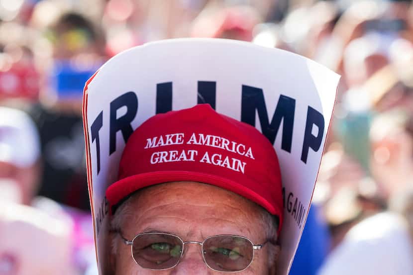 A supporter watched Donald Trump speak during a campaign rally Wednesday at the Central...