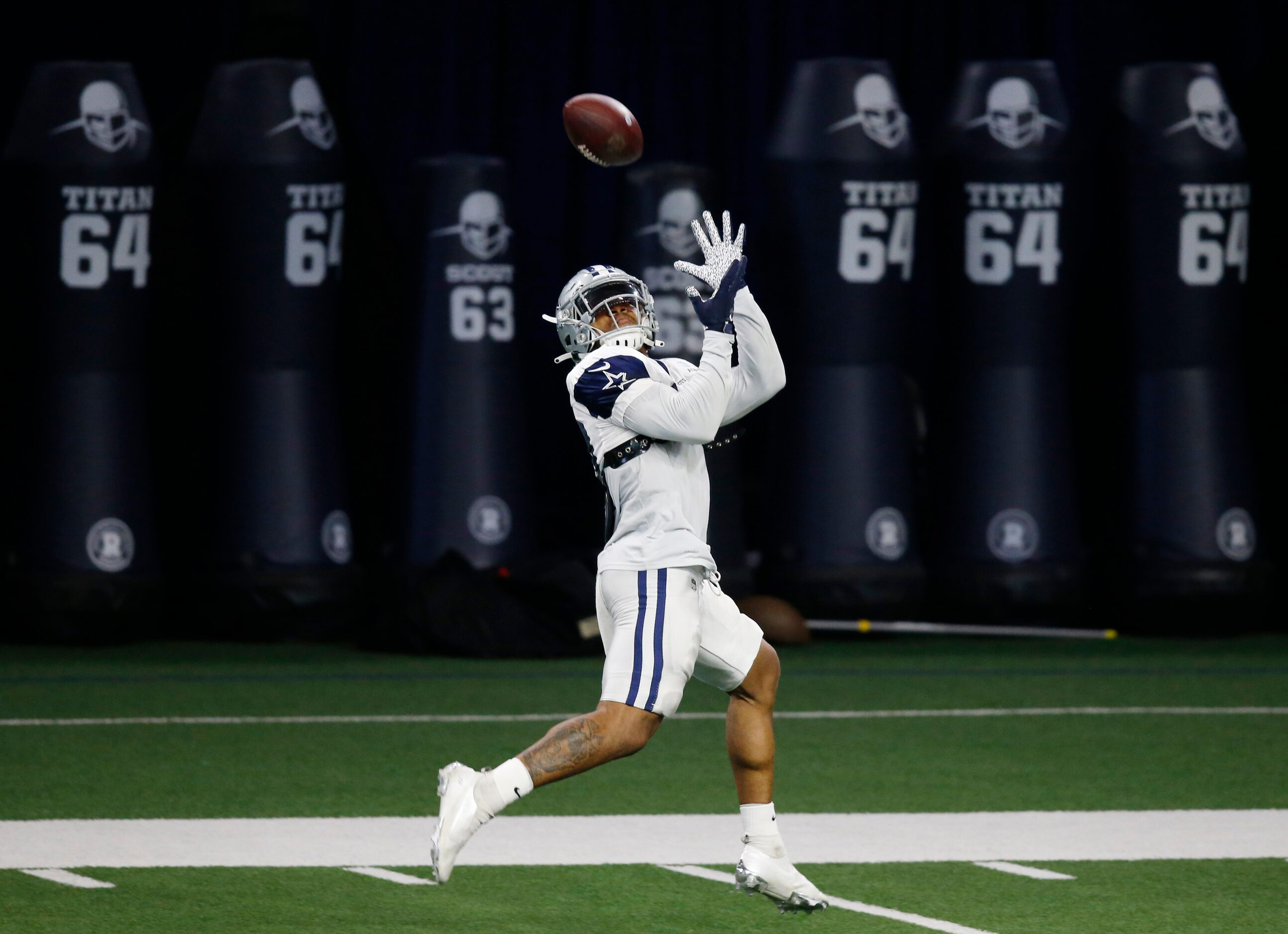 Dallas Cowboys running back Tony Pollard (20) catches a pass along the sideline in practice...