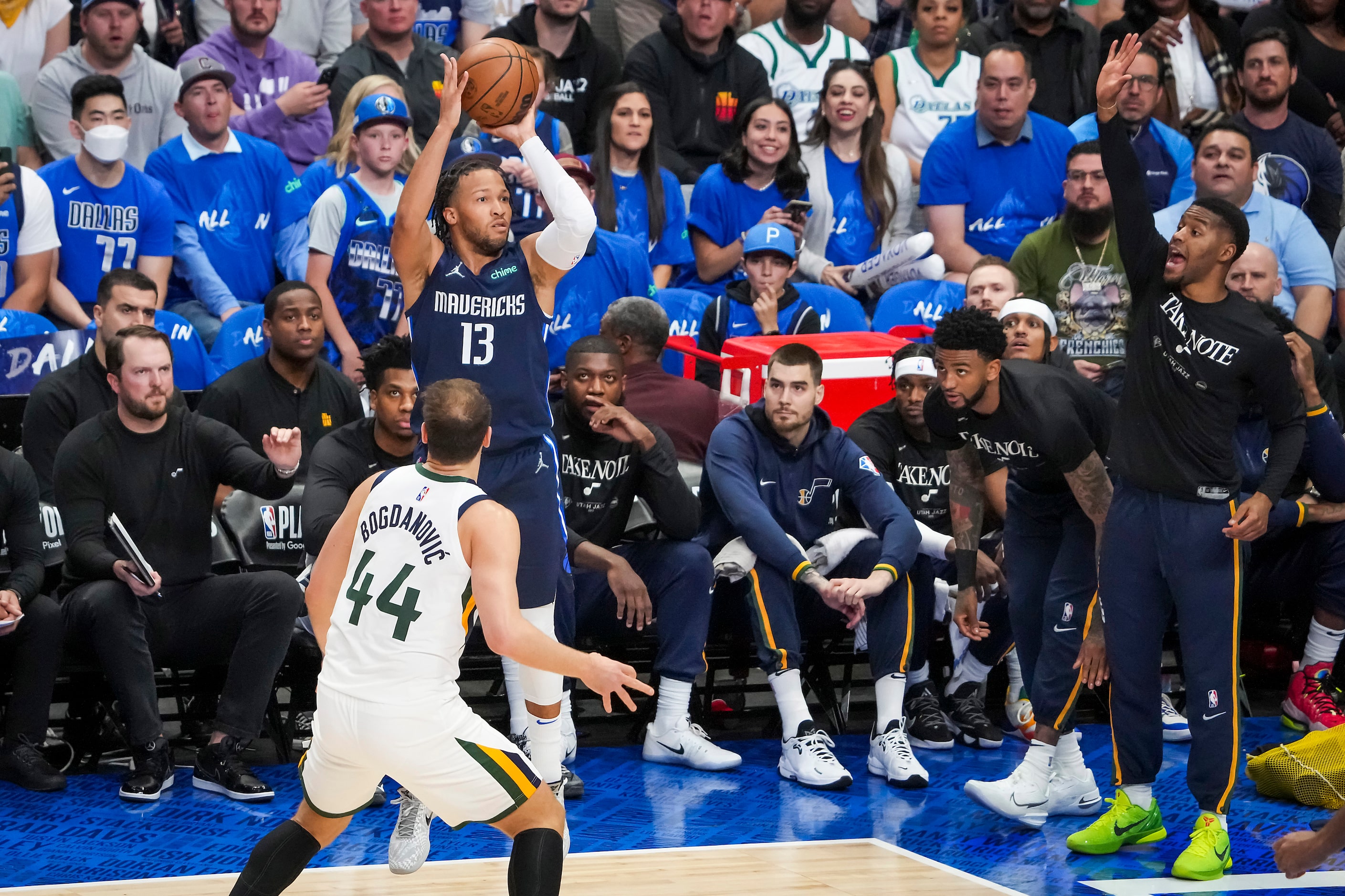 Dallas Mavericks guard Jalen Brunson (13) takes a 3-point attempt over Utah Jazz forward...