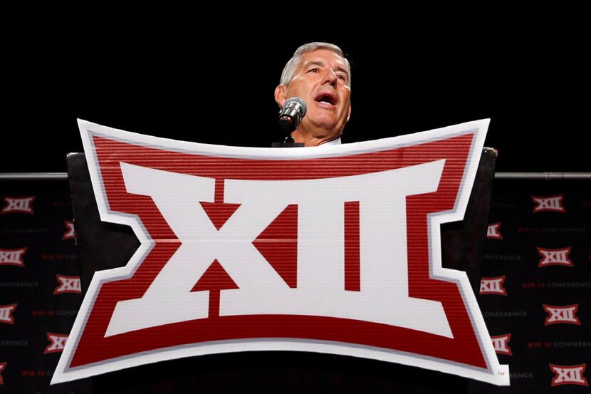 From behind the podium, Big XII Commissioner Bob Bowlsby address the media assembled for the...