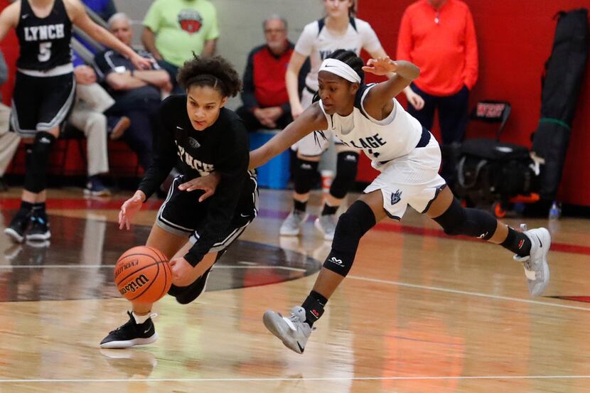 Bishop Lynch's Endyia Rogers (left) tries to get past The Village School's Kennedy Donovan...