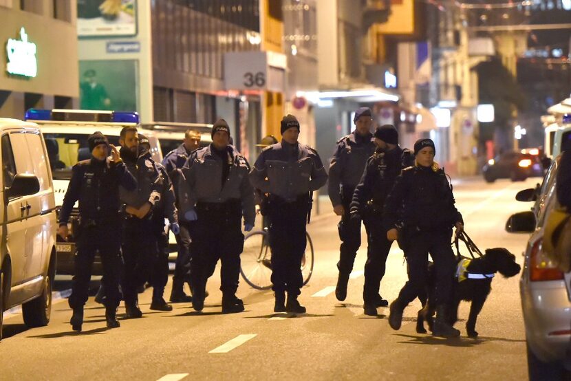 Swiss police officers are seen searching the area near a Muslim prayer hall, central Zurich,...