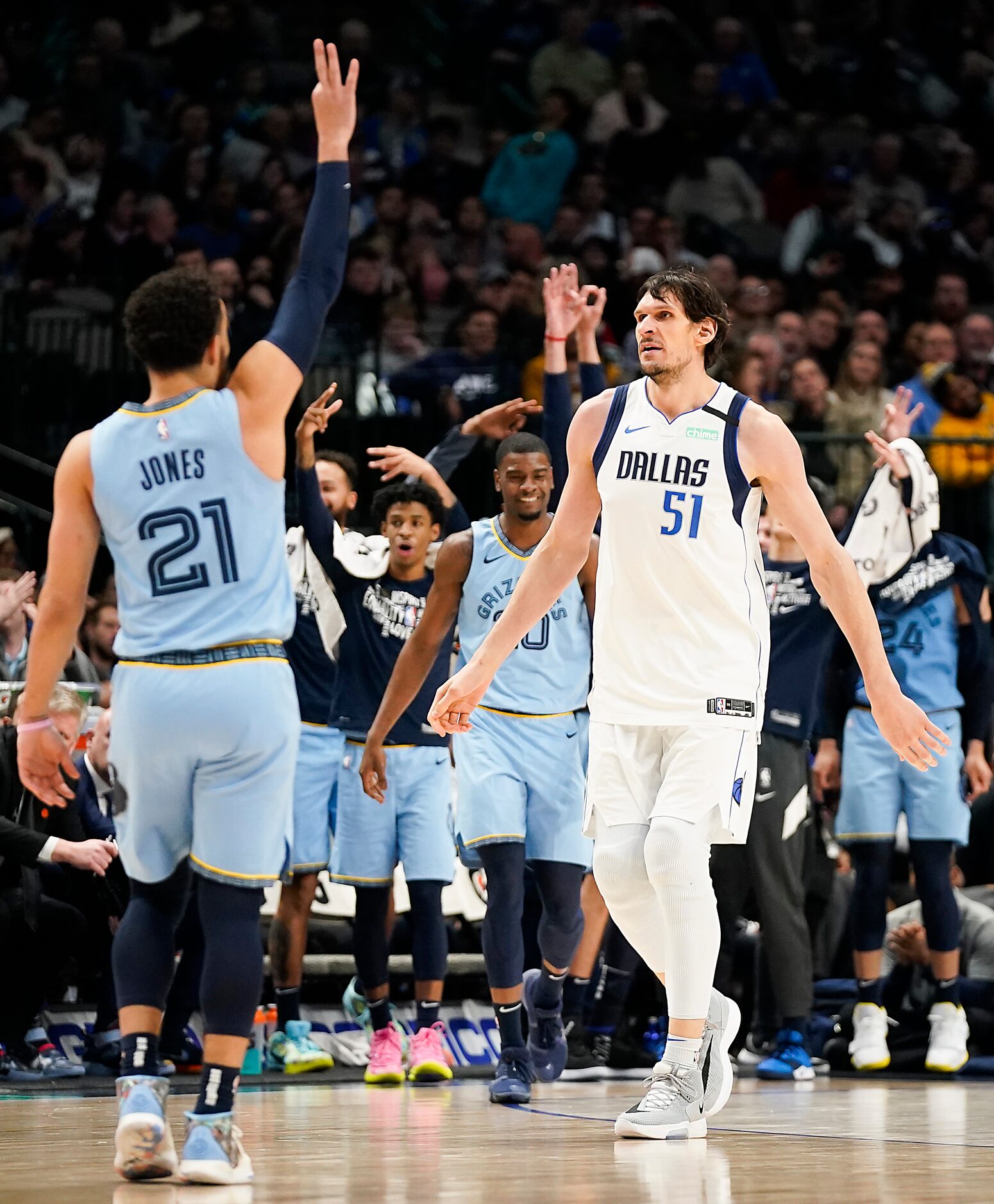 Dallas Mavericks center Boban Marjanovic (51) heads to the bench as the Mavericks call a...